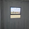 1 X 6M SHIPPING CONTAINER WITH DOOR AND WINDOWS WITH ELECTRICAL INSTALLED STOCK NR: 1586 - 15