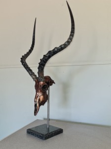 LOT 37 A set of bronzed Impala Skull/Horns on a granite base